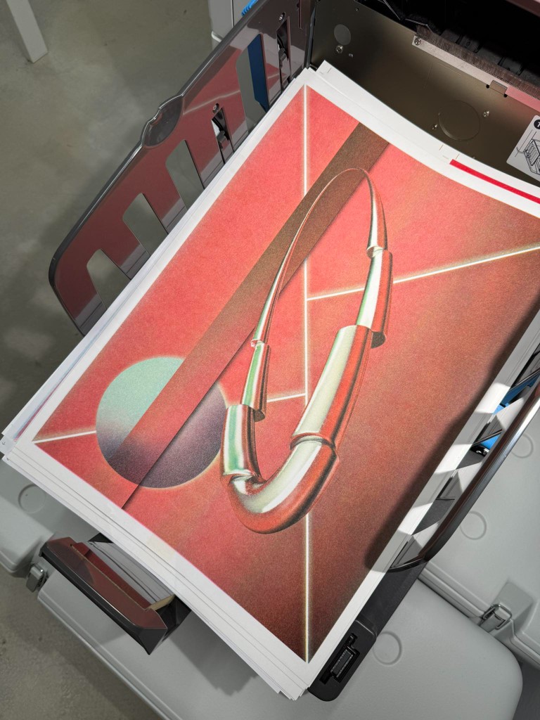 A stack of red prints in the output tray