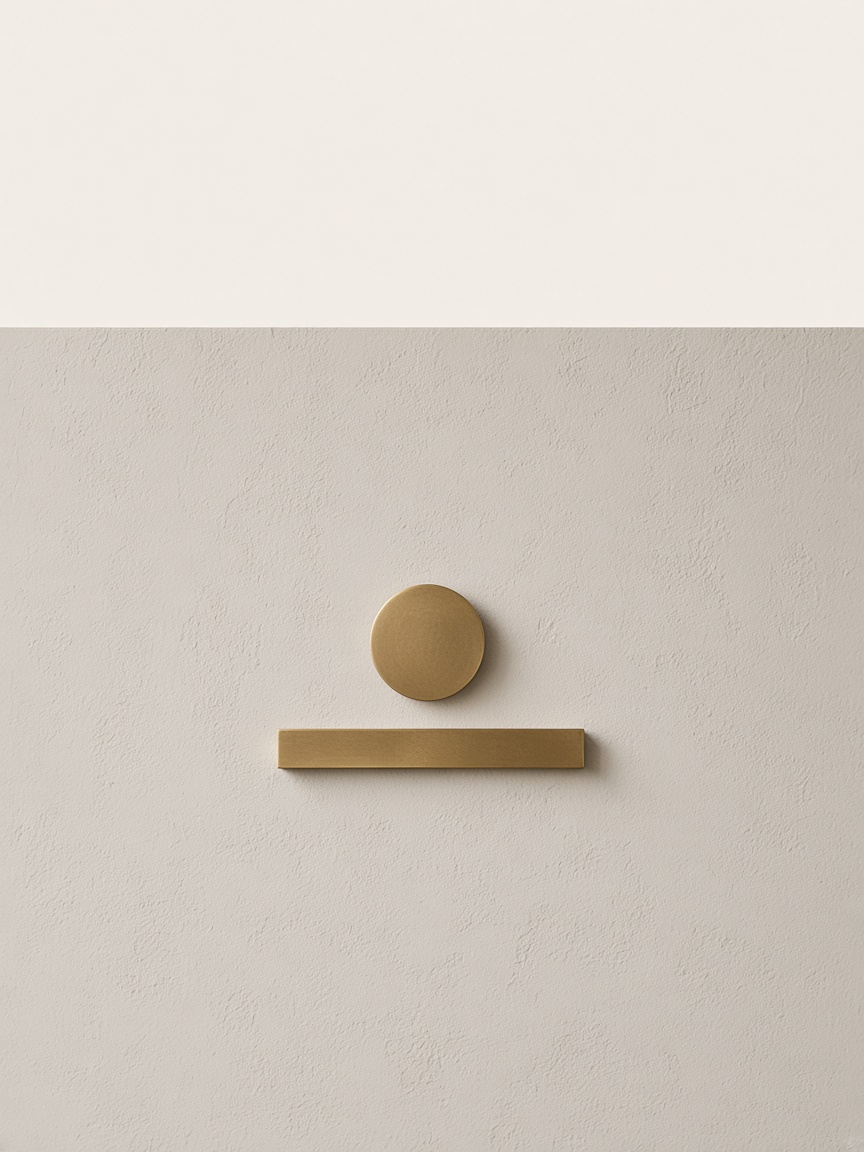 Brass circle and bar on plaster